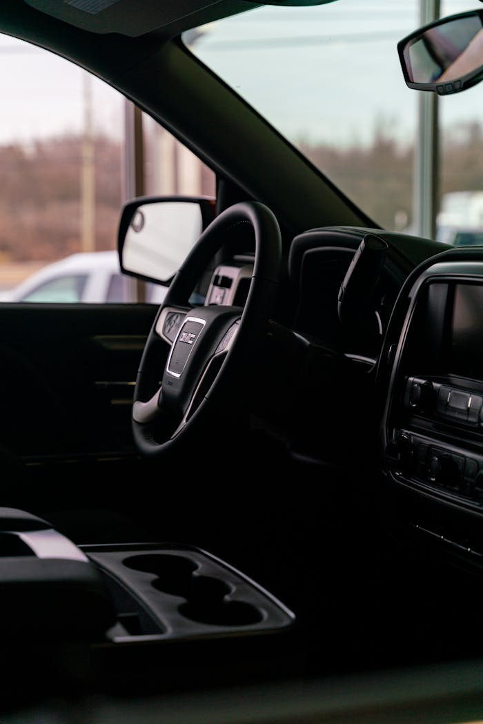 Mastering the First Impression: Your intriguing post title goes here Close-up view of a modern vehicle's dashboard and steering wheel. Ideal for automotive themes.